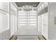 Spacious walk-in closet featuring custom shelves, hanging rods, a decorative ladder and an island for organization and convenience at 4807 W Longfellow Ave, Tampa, FL 33629