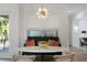 Bright dining area featuring a marble table, upholstered bench, stylish chairs, and a modern starburst chandelier at 4807 W Longfellow Ave, Tampa, FL 33629