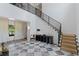Spacious foyer with marble floors, grand staircase, and abundant natural light at 4807 W Longfellow Ave, Tampa, FL 33629