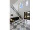 Grand foyer with high ceilings, staircase, marble floors, and modern black accents at 4807 W Longfellow Ave, Tampa, FL 33629