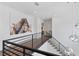 Hallway with iron railing and elegant light fixtures at 4807 W Longfellow Ave, Tampa, FL 33629