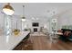 Expansive living area showcasing a kitchen, dining space, living room, and modern decor at 4807 W Longfellow Ave, Tampa, FL 33629