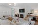 Bright living room featuring a fireplace, comfortable seating, and stylish decor at 4807 W Longfellow Ave, Tampa, FL 33629