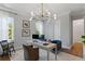 Stylish home office with large windows, comfortable seating, and modern desk setup at 4807 W Longfellow Ave, Tampa, FL 33629
