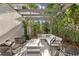 Outdoor living space with a fire pit, comfortable seating, and lush landscaping at 4807 W Longfellow Ave, Tampa, FL 33629