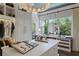 Walk-in closet featuring a large window providing natural light and custom shelving at 4807 W Longfellow Ave, Tampa, FL 33629