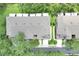 Aerial view of townhomes with well-maintained roofs and landscaping, surrounded by lush greenery and trees at 4910 Chatham Gate Dr # Dr, Riverview, FL 33578