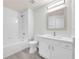 Well-lit bathroom features modern fixtures, a single sink vanity, and a shower and bath combo at 4910 Chatham Gate Dr, Riverview, FL 33578