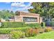 A beautifully landscaped entrance to the Valhalla community, featuring a brick sign and vibrant flowers at 4910 Chatham Gate Dr, Riverview, FL 33578