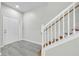 Bright entryway with a staircase and view of the front door and adjacent sidelight at 4910 Chatham Gate Dr, Riverview, FL 33578