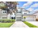 Charming two-story townhome with attached two-car garage and well-manicured landscaping at 4910 Chatham Gate Dr, Riverview, FL 33578