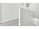 Bright hallway features modern gray flooring, fresh white walls, and an abundance of natural light at 4910 Chatham Gate Dr, Riverview, FL 33578