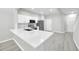 Bright kitchen with stainless appliances, white cabinets, quartz countertops, and subway tile backsplash at 4910 Chatham Gate Dr, Riverview, FL 33578
