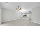 Spacious living area featuring a ceiling fan and open layout with views to the kitchen at 4910 Chatham Gate Dr, Riverview, FL 33578