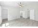 Bright main bedroom with stylish ceiling fan, multiple walk-in closets, and a door to the en-suite bathroom at 4910 Chatham Gate Dr # Dr, Riverview, FL 33578