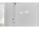 Shower and bath combo feature modern fixtures and a clean, bright white aesthetic at 4910 Chatham Gate Dr, Riverview, FL 33578