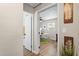 Bright home office with a white desk, wood floors, and a green area rug at 512 Flame Tree Dr, Apollo Beach, FL 33572