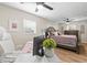 This home office is connected to the main bedroom and has stylish modern furnishings at 512 Flame Tree Dr, Apollo Beach, FL 33572