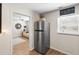 Stainless steel refrigerator located off of living room area at 512 Flame Tree Dr, Apollo Beach, FL 33572