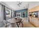 Bright dining area with modern table, chairs, and stylish breakfast bar at 5540 Applegate Dr, Spring Hill, FL 34606
