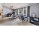 Dining area with modern lighting, large windows, and functional workspace at 5540 Applegate Dr, Spring Hill, FL 34606