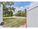 Scenic view of the front yard, showcasing lush greenery and the surrounding neighborhood at 5540 Applegate Dr, Spring Hill, FL 34606