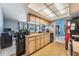 Well-lit kitchen with tile floors, wooden cabinets, and stainless steel appliances at 5540 Applegate Dr, Spring Hill, FL 34606