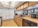 Functional kitchen with wooden cabinets, double basin sink, and appliances at 5540 Applegate Dr, Spring Hill, FL 34606