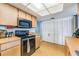 Functional kitchen with appliances, wooden cabinets, and ample pantry storage at 5540 Applegate Dr, Spring Hill, FL 34606