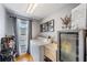 Bright laundry room equipped with a washer, dryer, utility sink, and storage at 5540 Applegate Dr, Spring Hill, FL 34606