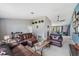 Comfortable living room with plush leather sofas, ottoman, and stylish furnishings at 5540 Applegate Dr, Spring Hill, FL 34606