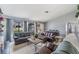 Spacious living area featuring sofas, tables, and ample room for Gathering and guests at 5540 Applegate Dr, Spring Hill, FL 34606
