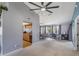 Open-concept living space with ceiling fan, dining area, and seamless flow at 5540 Applegate Dr, Spring Hill, FL 34606