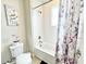 Bright bathroom showing a tub and shower combo with decorative shower curtain and tile surround at 6118 Voyagers Pl, Apollo Beach, FL 33572