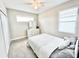 Bedroom with neutral paint, plush carpet and a ceiling fan for added comfort at 6118 Voyagers Pl, Apollo Beach, FL 33572
