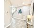 Welcoming foyer with tile floors, a staircase, modern decor, and ample natural light at 6118 Voyagers Pl, Apollo Beach, FL 33572