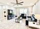 Comfortable living room boasts a large television, stylish furnishings, and a cozy atmosphere at 6118 Voyagers Pl, Apollo Beach, FL 33572