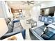 Spacious living room with an open layout, modern decor, and ample seating for entertaining at 6118 Voyagers Pl, Apollo Beach, FL 33572