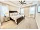 Spacious main bedroom features a trey ceiling, a ceiling fan and large windows with lots of natural light at 6118 Voyagers Pl, Apollo Beach, FL 33572