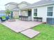 Brick paved patio features an outdoor kitchen, a fire pit and outdoor seating at 6118 Voyagers Pl, Apollo Beach, FL 33572