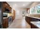 Updated kitchen with wooden cabinets, granite countertops, and stainless steel appliances at 6419 S Englewood Ave, Tampa, FL 33611