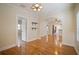Bright living room with hardwood floors, arched doorway, and plenty of natural light at 6419 S Englewood Ave, Tampa, FL 33611