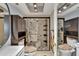 Bright bathroom showcasing a shower with unique design elements and modern dark wood vanity at 644 Yardarm Dr # 22, Apollo Beach, FL 33572