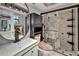 Bright bathroom showcasing a shower with unique design elements and modern white vanity at 644 Yardarm Dr # 22, Apollo Beach, FL 33572