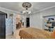 Bright bedroom with access to dining area, closet, and decorative wall art at 644 Yardarm Dr # 22, Apollo Beach, FL 33572