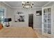 Comfortable bedroom with modern decor, a large bed, and a door to the outside at 644 Yardarm Dr # 22, Apollo Beach, FL 33572