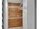 Walk-in closet featuring wooden paneling, white wire shelving, and ample storage space at 644 Yardarm Dr # 22, Apollo Beach, FL 33572
