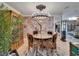 Elegant dining area featuring decorative lighting, accent wall and unique furnishings at 644 Yardarm Dr # 22, Apollo Beach, FL 33572