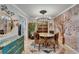 Elegant dining room featuring a unique chandelier, stylish decor, and designer accents at 644 Yardarm Dr # 22, Apollo Beach, FL 33572