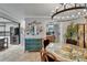Elegant dining area with decorative mirror and light fixture open to the kitchen and bedroom at 644 Yardarm Dr # 22, Apollo Beach, FL 33572